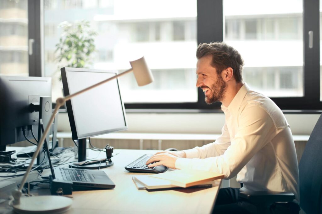 Smiling guy at his desk